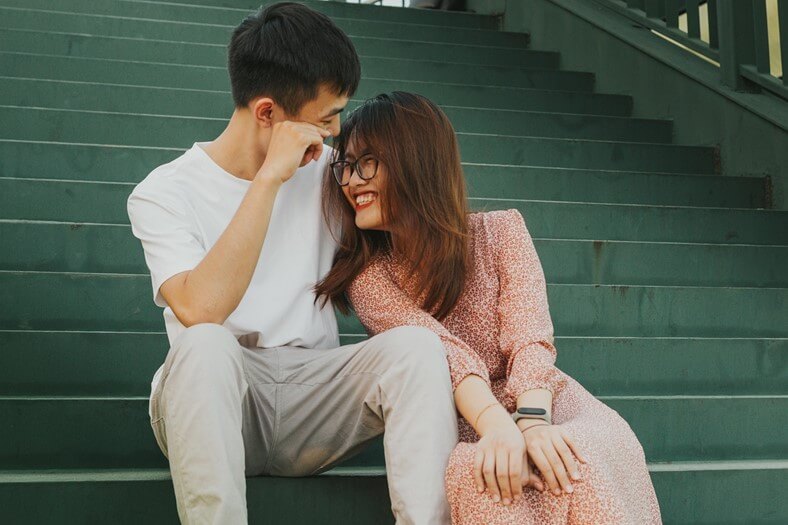 Couple sitting closely together, demonstrating emotional connection and secure attachment.