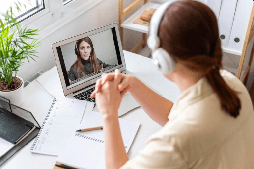 Person reflecting on life transitions during online therapy session